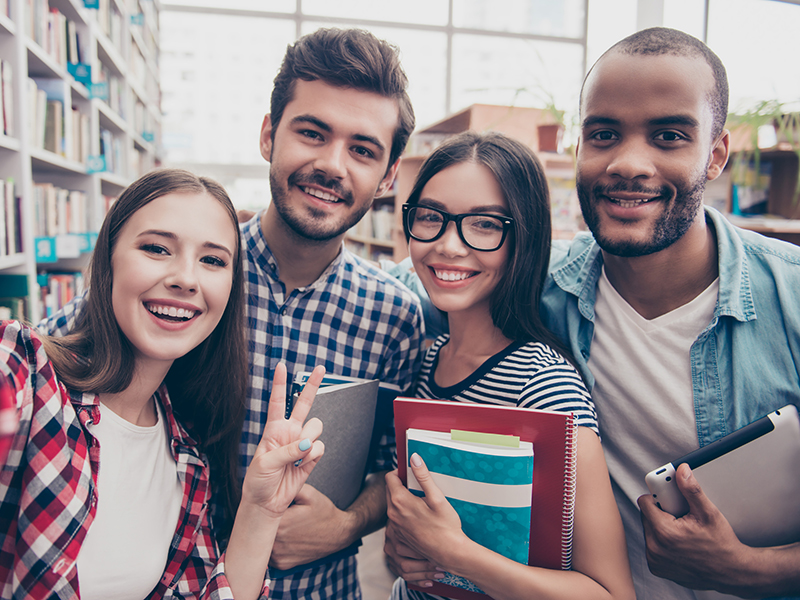 Students standing in a circle for a selfie. 