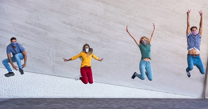 students-jumping-in-the-area-celebrating