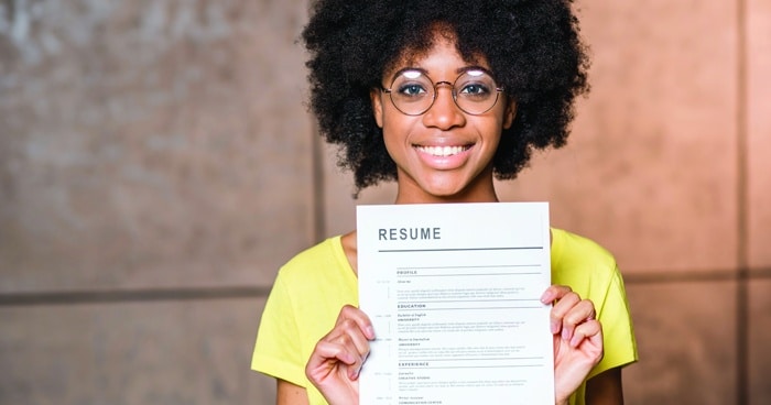 african-american-girl-holding-up-resume