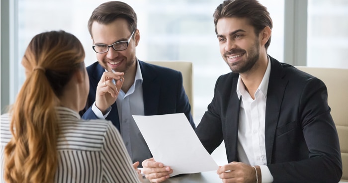 two-males-one-female-working-at-desk