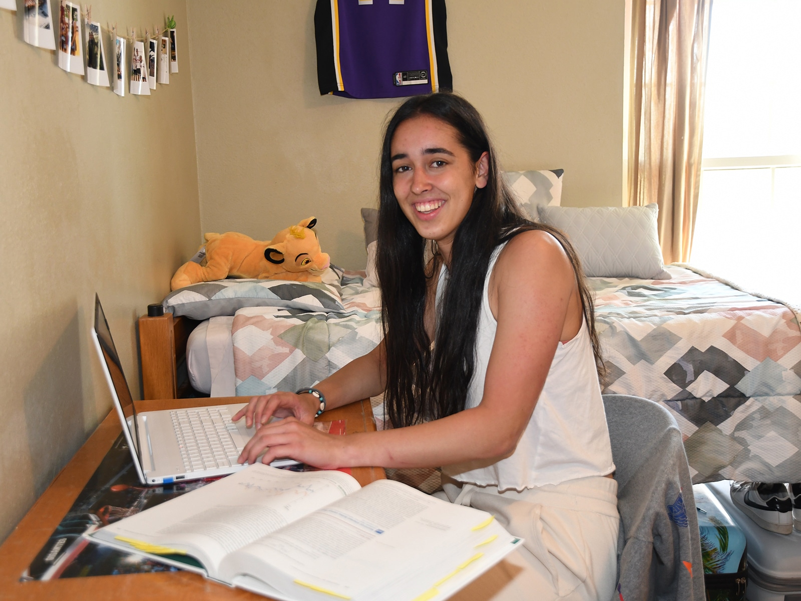 student-studying-at-desk-in-dorms