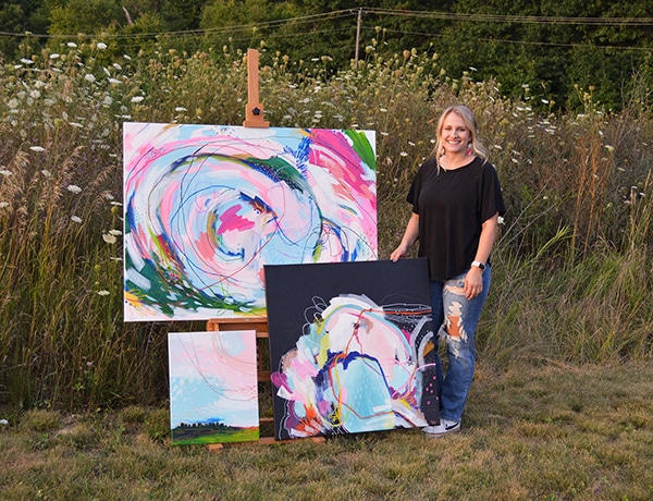 Stephani Hopwood with several of the paintings she will have on display in Ray Frederick Gallery at MCC during her exhibit Sept. 5 - 29.