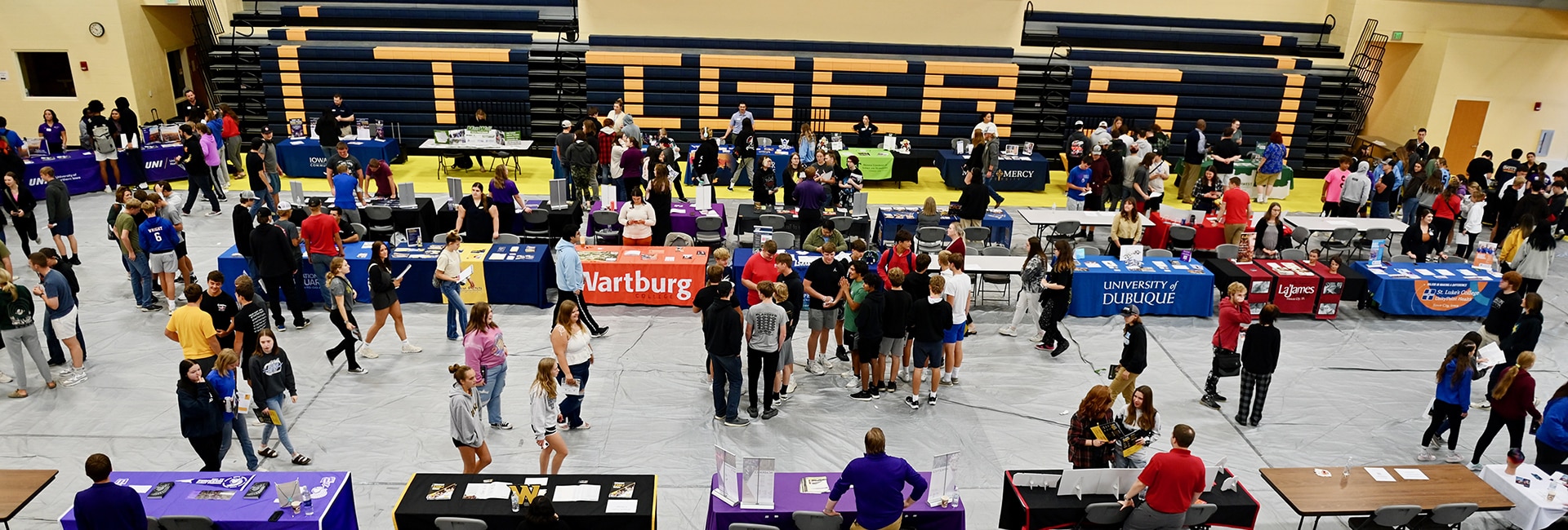 mcc-gym-with-students-looking-through-booths