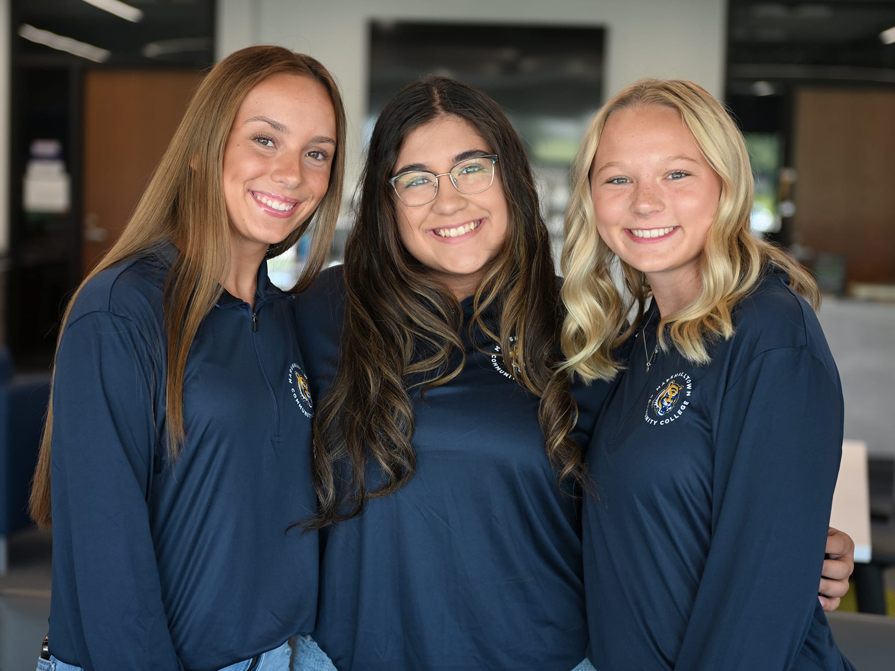 three-female-students-in-library