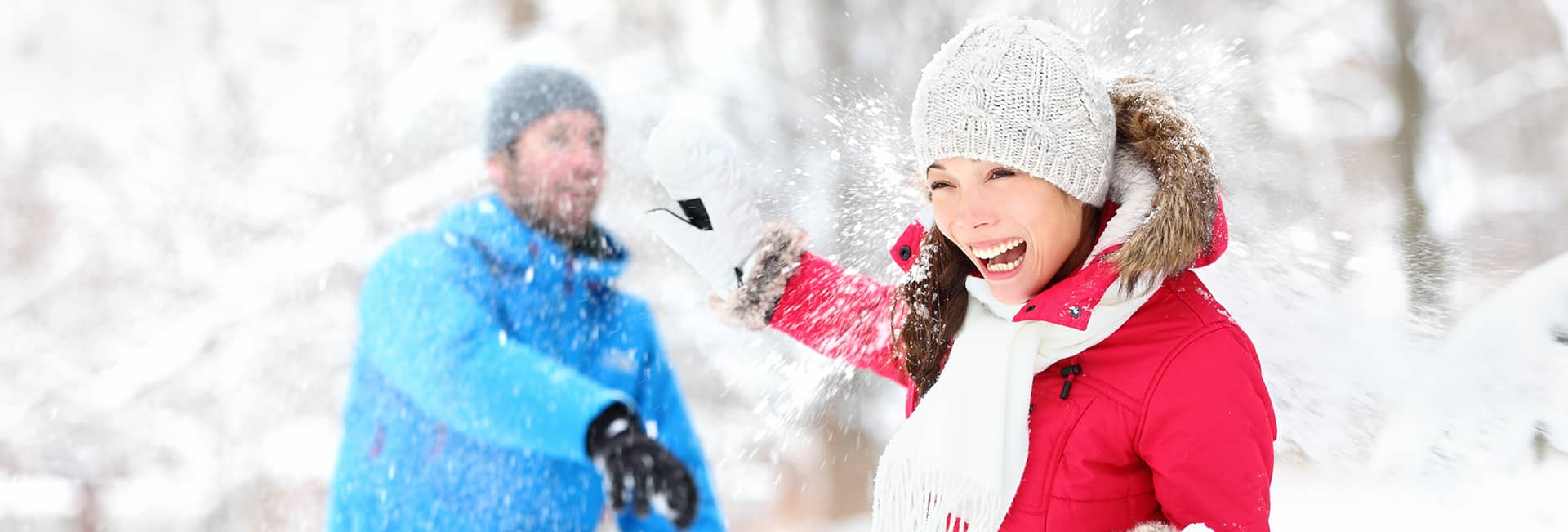 male-and-female-playing-in-snow-snowball-fight