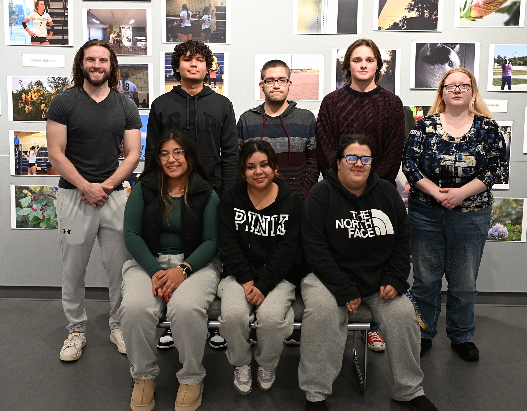 photography-students-in-front-of-their-exhibit