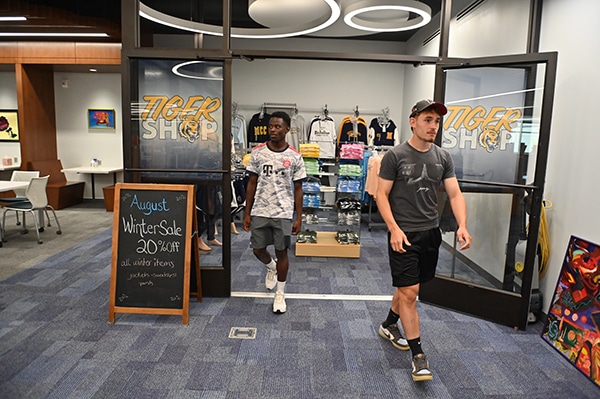 students-walking-out-of-tiger-shop