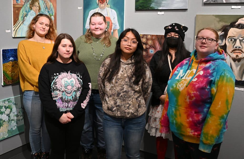 art-students-in-front-of-exhibit