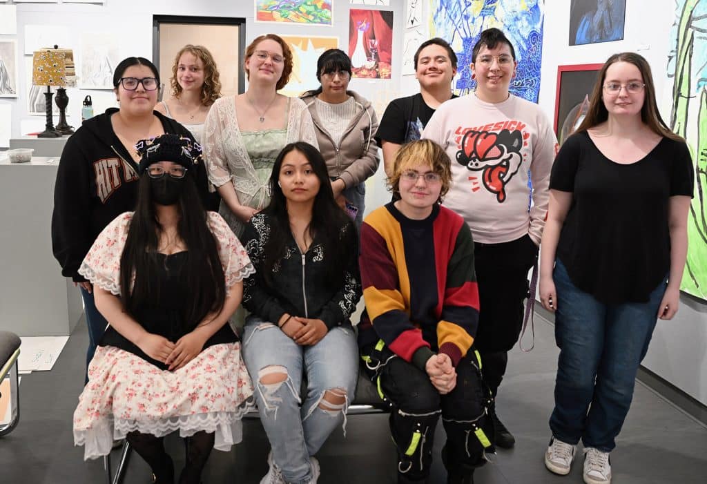 drawing-and-3D-students-in-front-of-their-exhibit